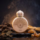 OUD MOOD 100ml — creamy white disc-shaped flacon with gold mandala engraving and white mosque-dome cap with green gemstones on wet dark obsidian, surrounded by dark agarwood (oud), dried patchouli leaves, papyrus reeds, and golden amber-ambroxan resin amid smoky incense haze — deep mysterious oud-wood-resin mood.